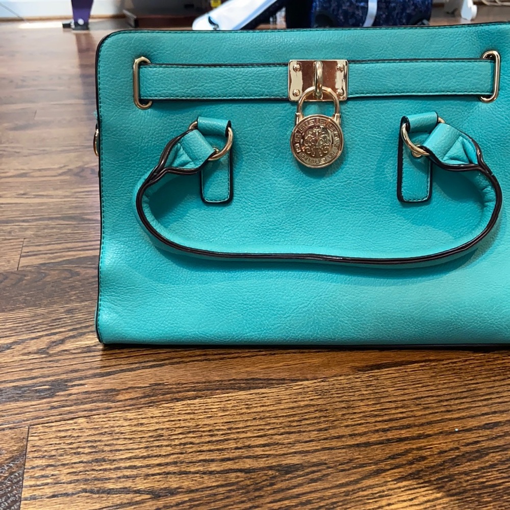 Teal bag with gold accents